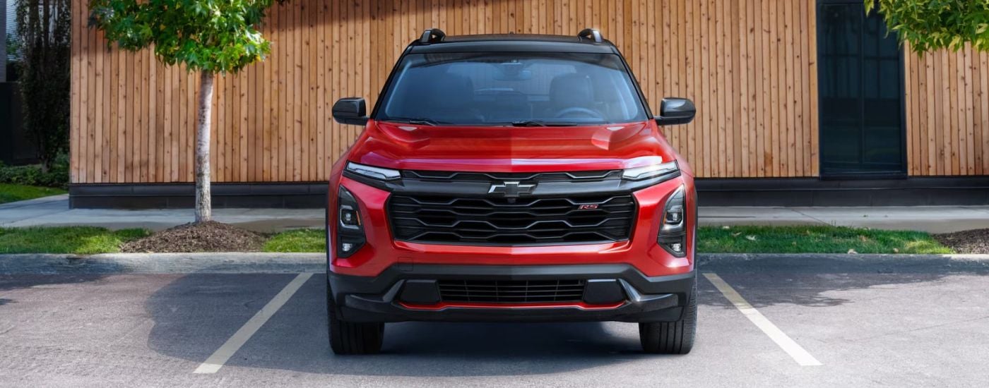 Red 2025 Chevy Equinox RS parked on a parking spot