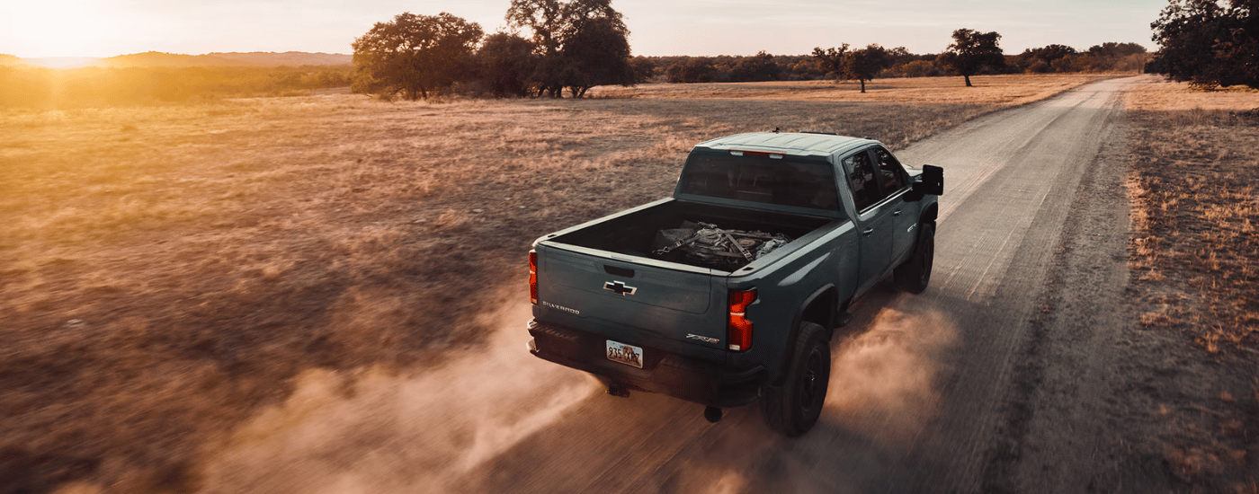 Green 2026 Chevy Silverado 2500 HD ZR2 kicking up dust